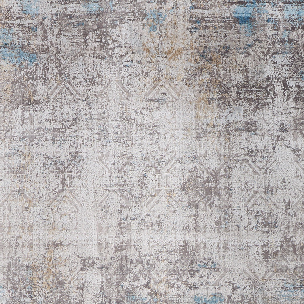 5' X 8' Ivory Gray and Blue Abstract Power Loom Area Rug With Fringe