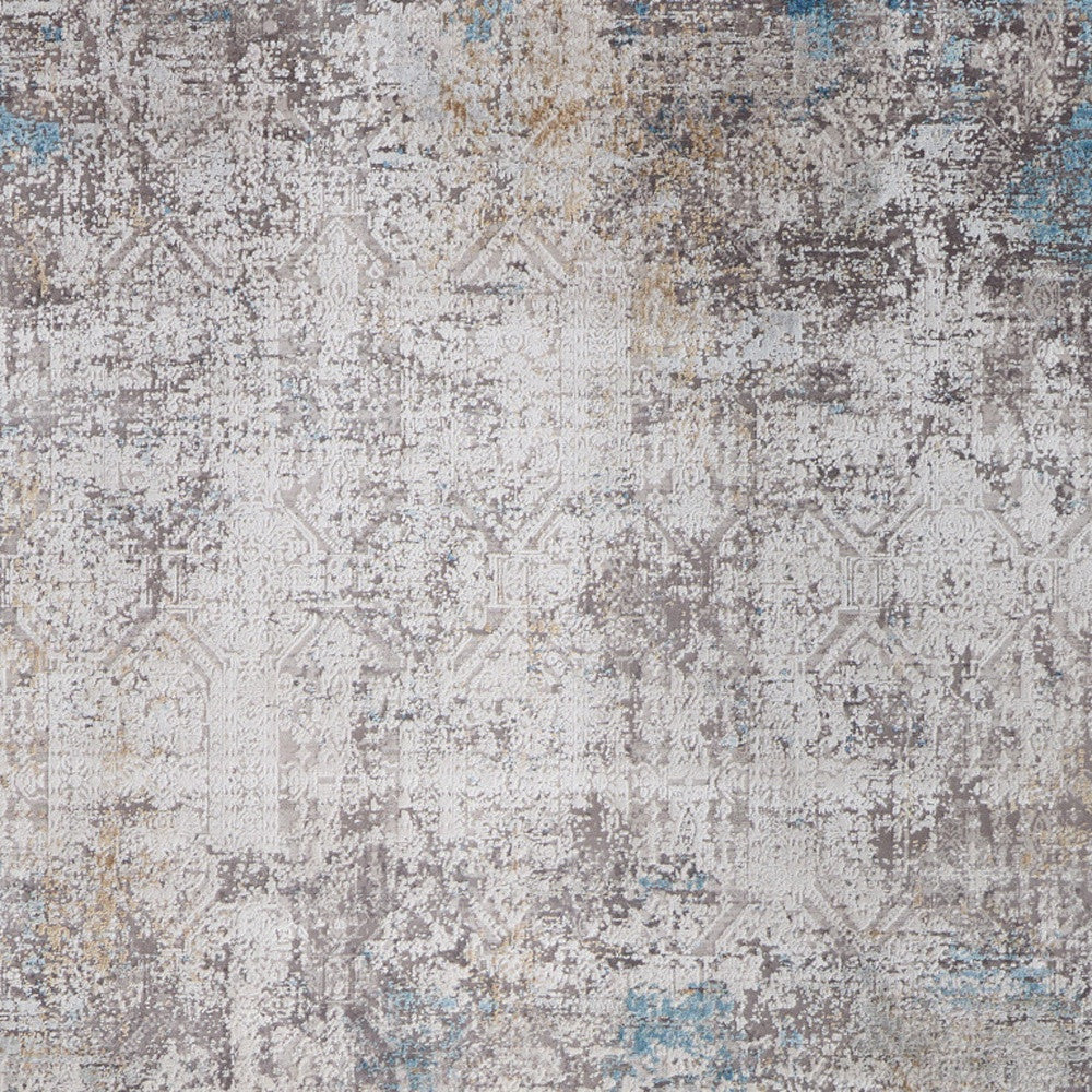 5' X 8' Ivory Gray and Blue Abstract Power Loom Area Rug With Fringe