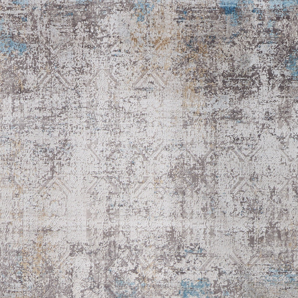 5' X 8' Ivory Gray and Blue Abstract Power Loom Area Rug With Fringe