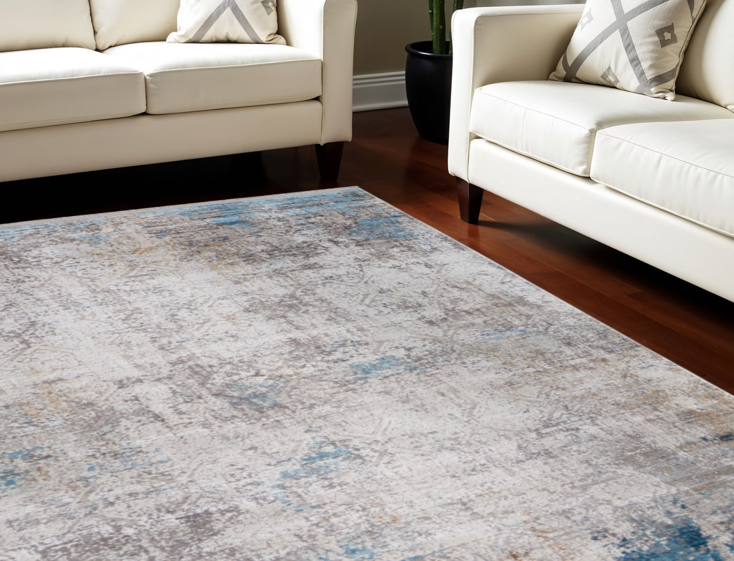 5' X 8' Ivory Gray and Blue Abstract Power Loom Area Rug With Fringe