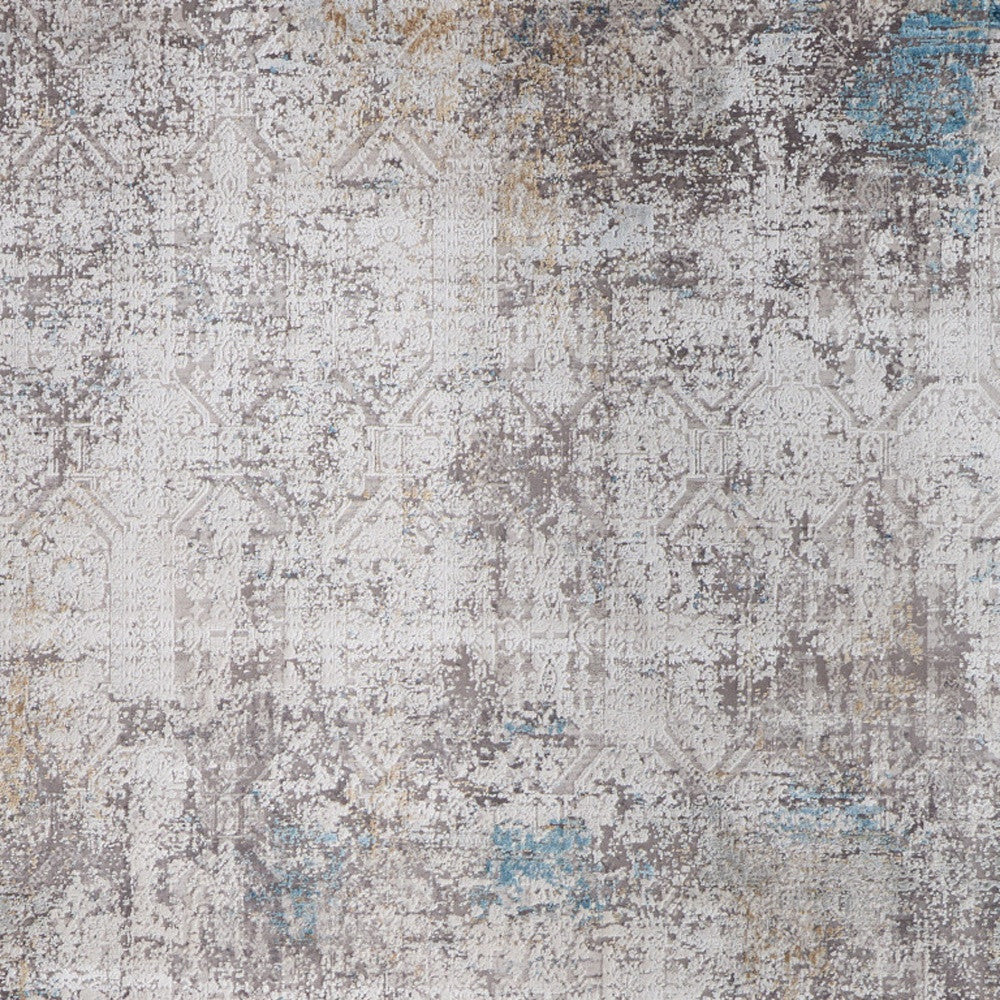 5' X 8' Ivory Gray and Blue Abstract Power Loom Area Rug With Fringe