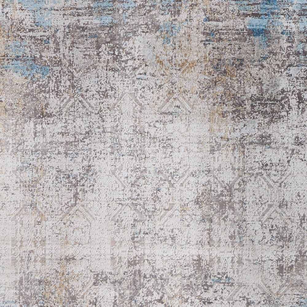 5' X 8' Ivory Gray and Blue Abstract Power Loom Area Rug With Fringe