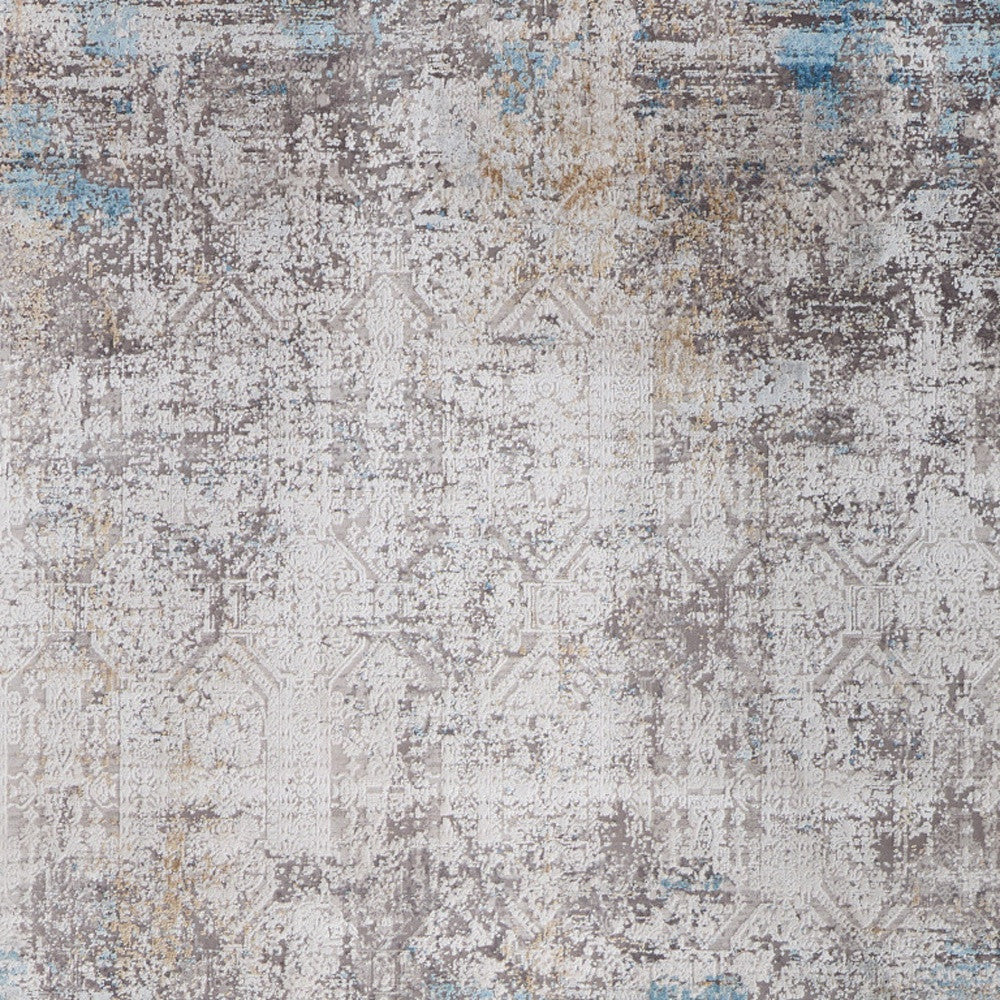 5' X 8' Ivory Gray and Blue Abstract Power Loom Area Rug With Fringe
