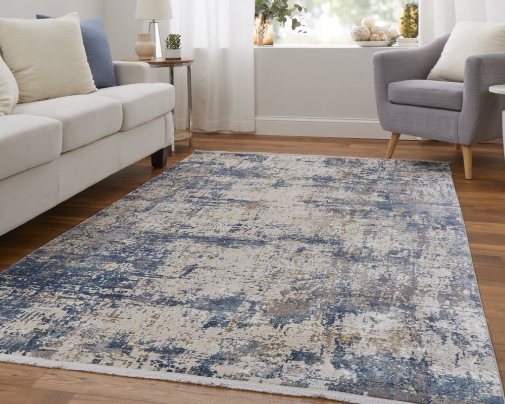 3' X 5' Ivory Tan and Blue Abstract Power Loom Area Rug With Fringe