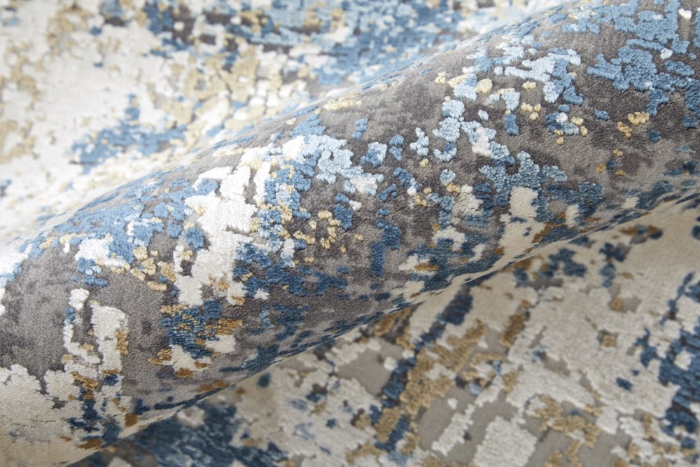 3' X 5' Ivory Tan and Blue Abstract Power Loom Area Rug With Fringe