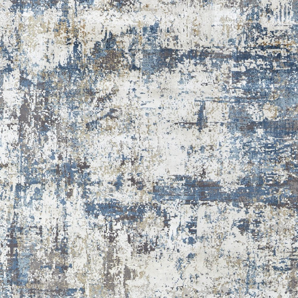 3' X 5' Ivory Tan and Blue Abstract Power Loom Area Rug With Fringe