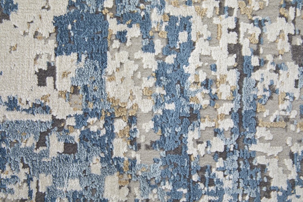 3' X 5' Ivory Tan and Blue Abstract Power Loom Area Rug With Fringe