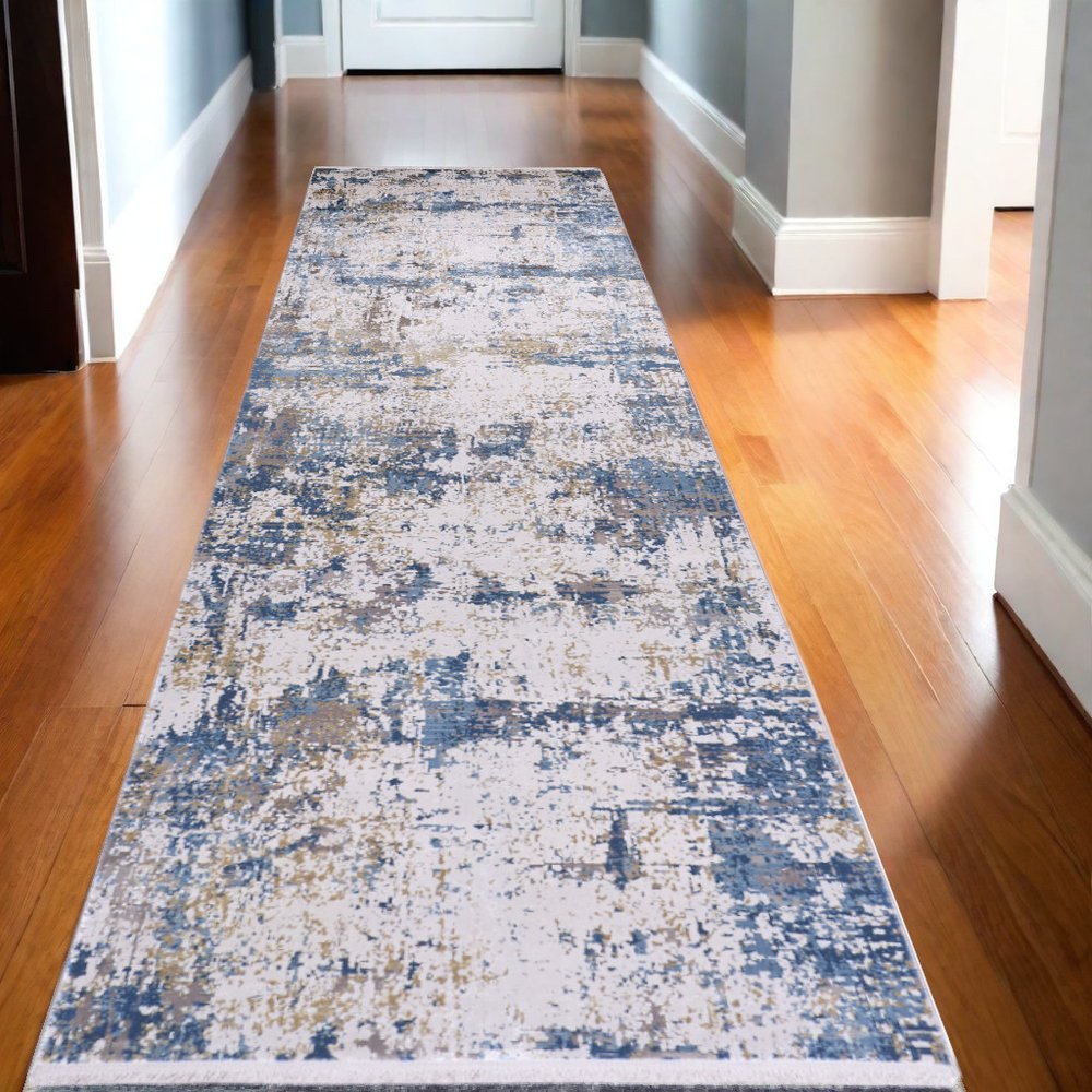 3' X 5' Ivory Tan and Blue Abstract Power Loom Area Rug With Fringe