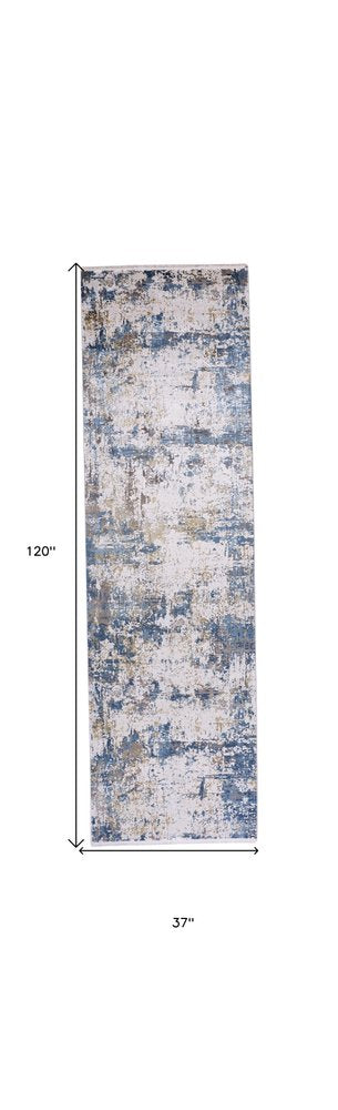 3' X 5' Ivory Tan and Blue Abstract Power Loom Area Rug With Fringe