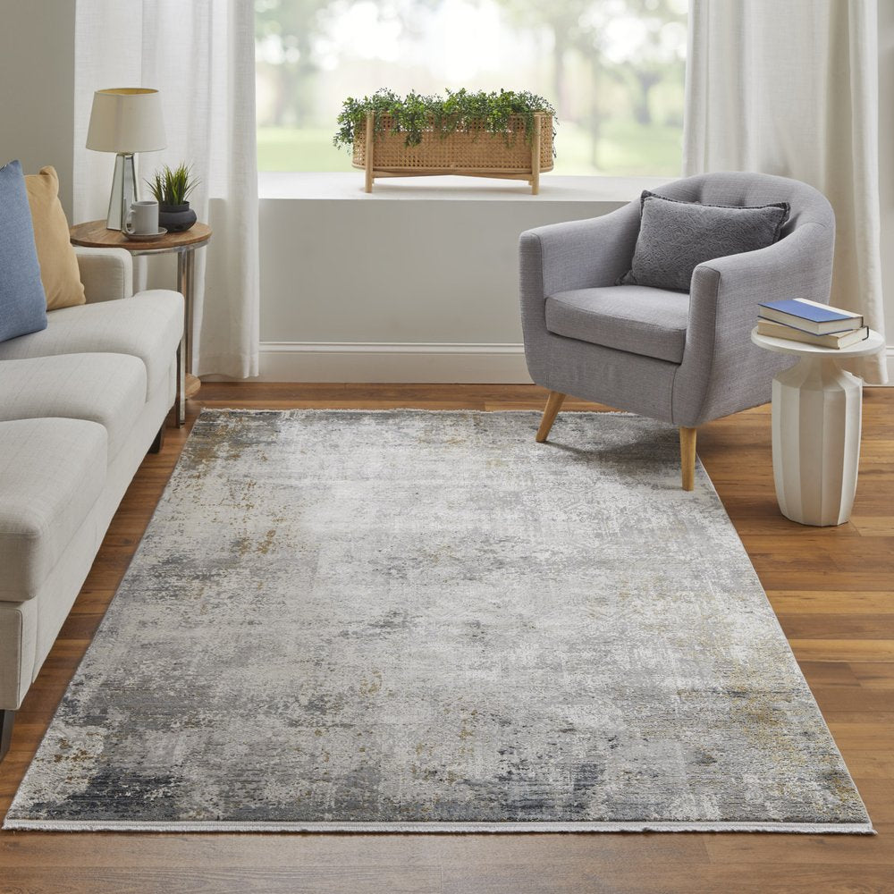 3' X 5' Ivory Taupe and Gray Abstract Power Loom Distressed Area Rug With Fringe