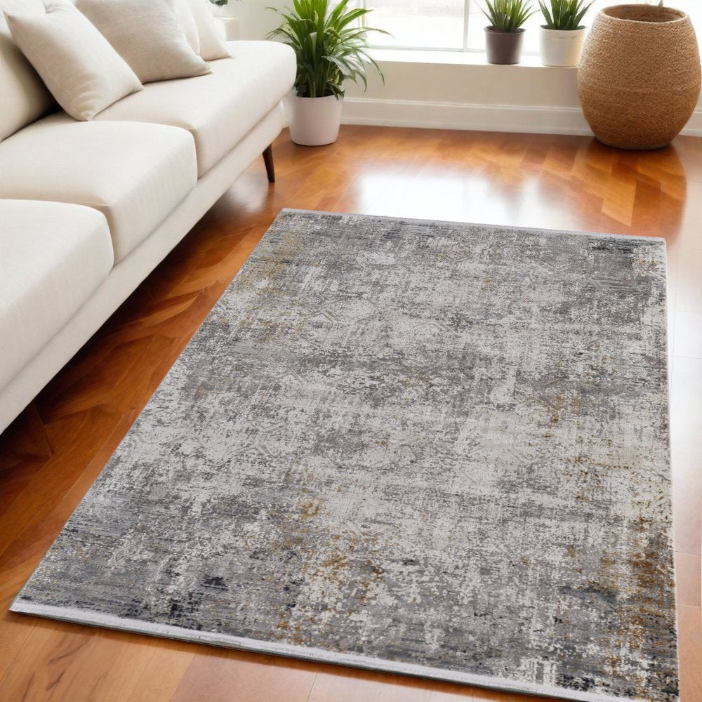 3' X 5' Ivory Taupe and Gray Abstract Power Loom Distressed Area Rug With Fringe