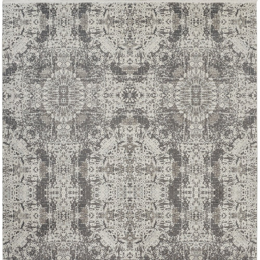 5' X 8' Ivory Taupe and Gray Abstract Power Loom Distressed Area Rug With Fringe