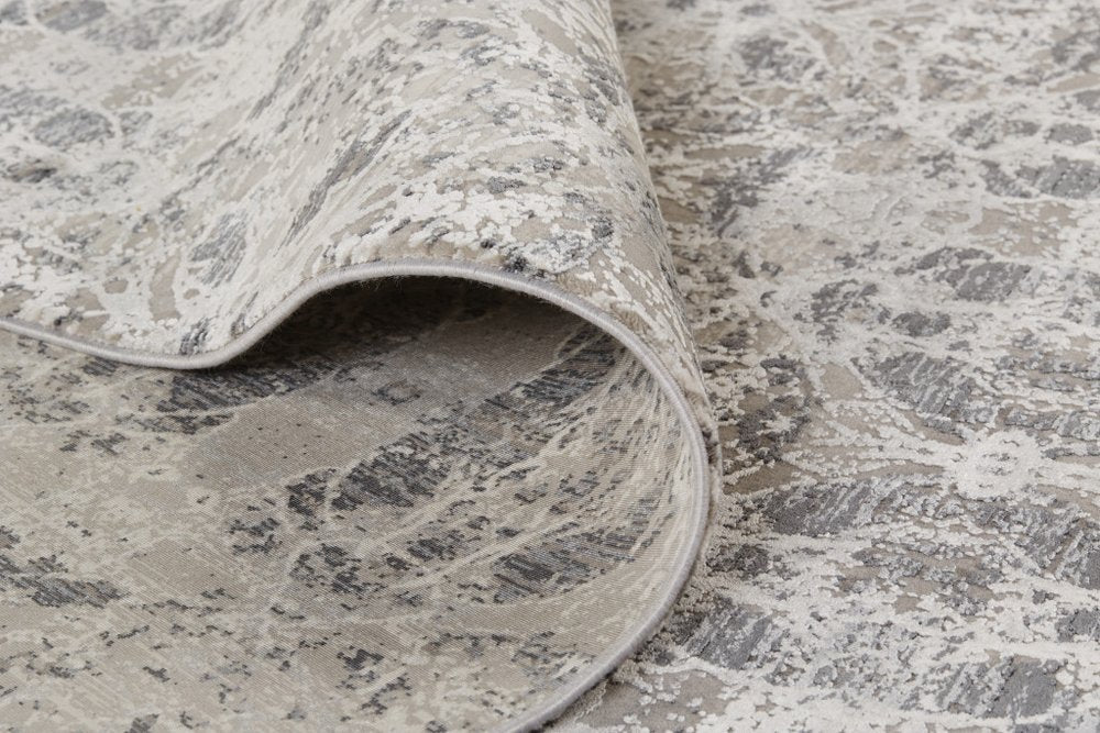 5' X 8' Ivory Taupe and Gray Oriental Power Loom Area Rug With Fringe