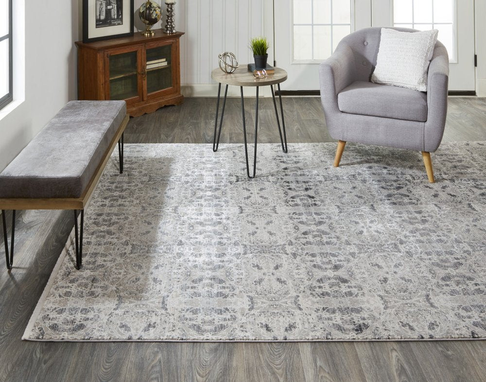 5' X 8' Ivory Taupe and Gray Oriental Power Loom Area Rug With Fringe