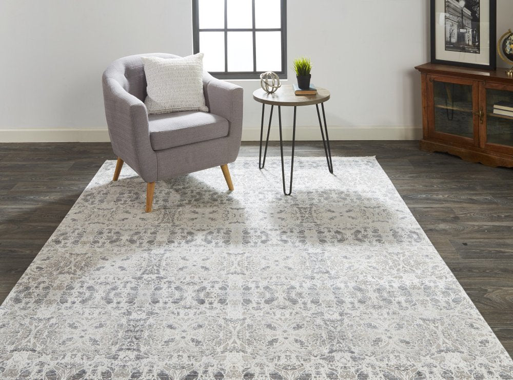 5' X 8' Ivory Taupe and Gray Oriental Power Loom Area Rug With Fringe