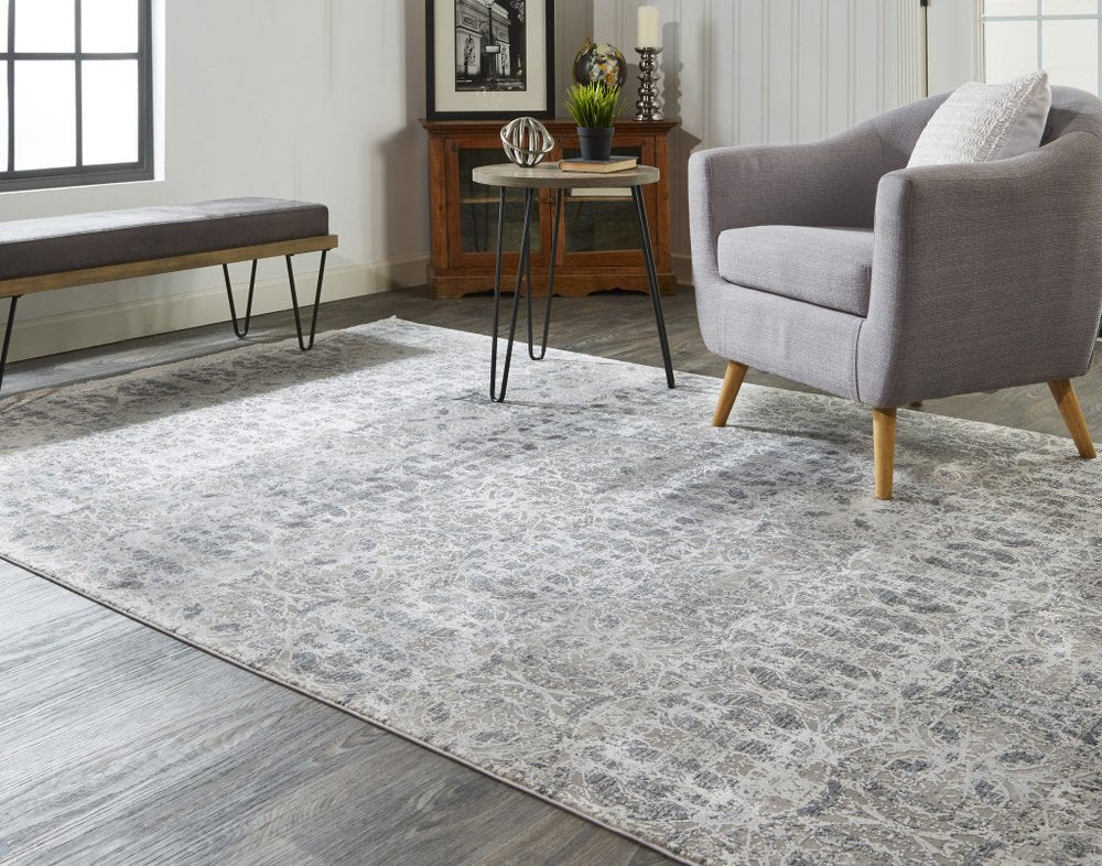 5' X 8' Ivory Taupe and Gray Oriental Power Loom Area Rug With Fringe
