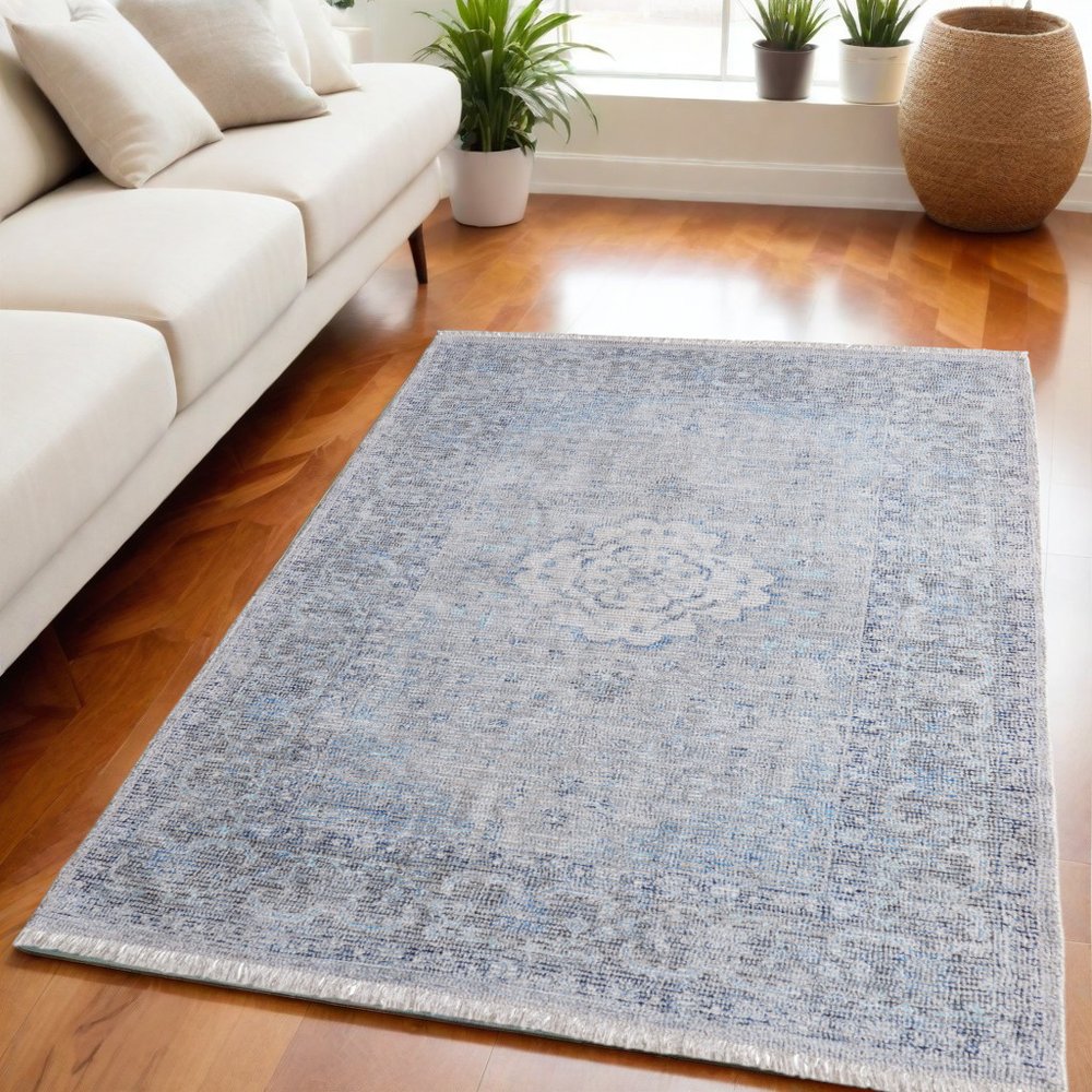 5' X 8' Gray Blue and Ivory Oriental Hand Woven Distressed Area Rug With Fringe