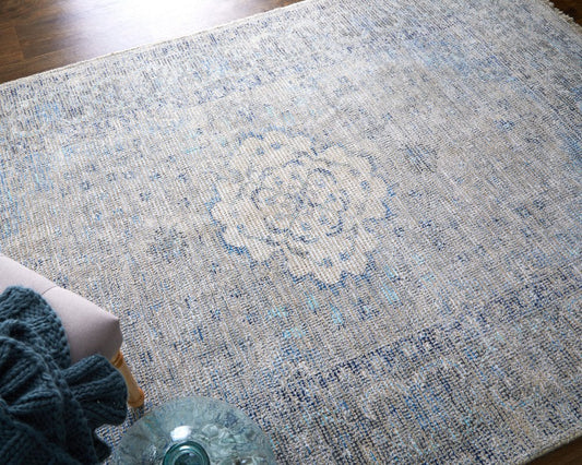 5' X 8' Gray Blue and Ivory Oriental Hand Woven Distressed Area Rug With Fringe