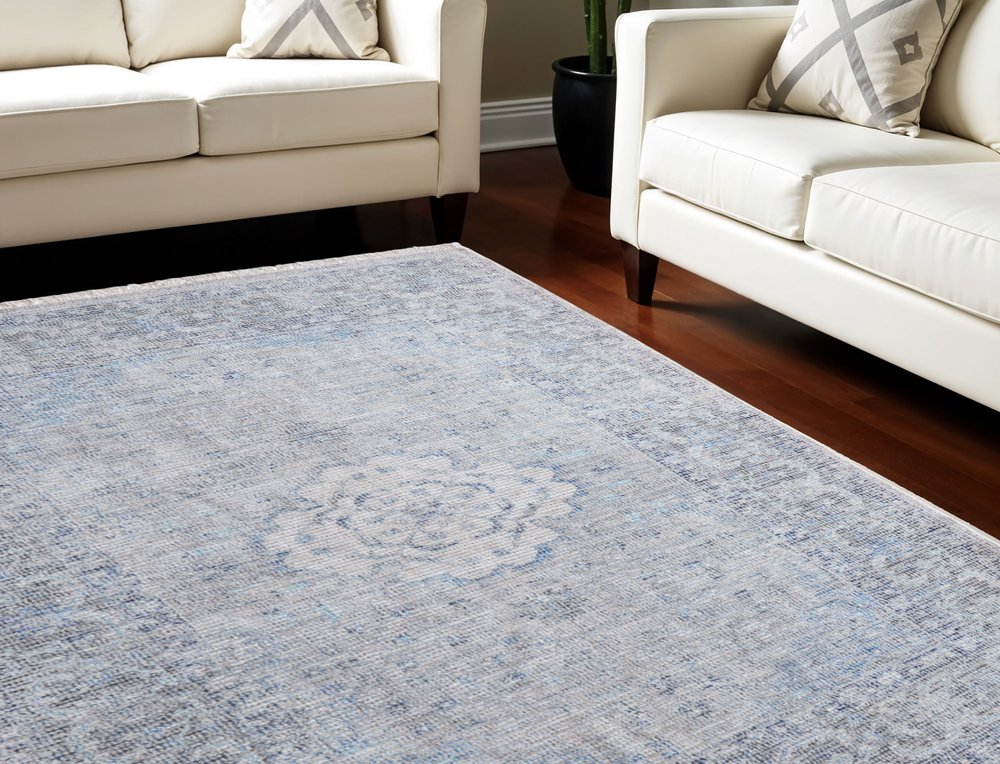 5' X 8' Gray Blue and Ivory Oriental Hand Woven Distressed Area Rug With Fringe