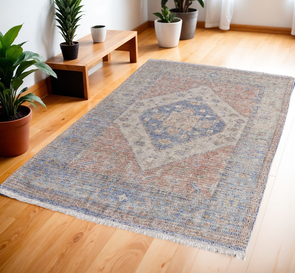 9' X 12' Red Blue and Ivory Abstract Hand Woven Distressed Area Rug With Fringe