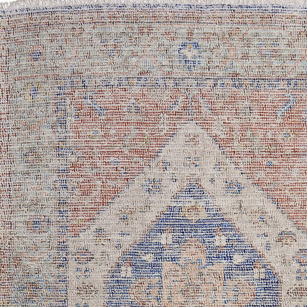 9' X 12' Red Blue and Ivory Abstract Hand Woven Distressed Area Rug With Fringe