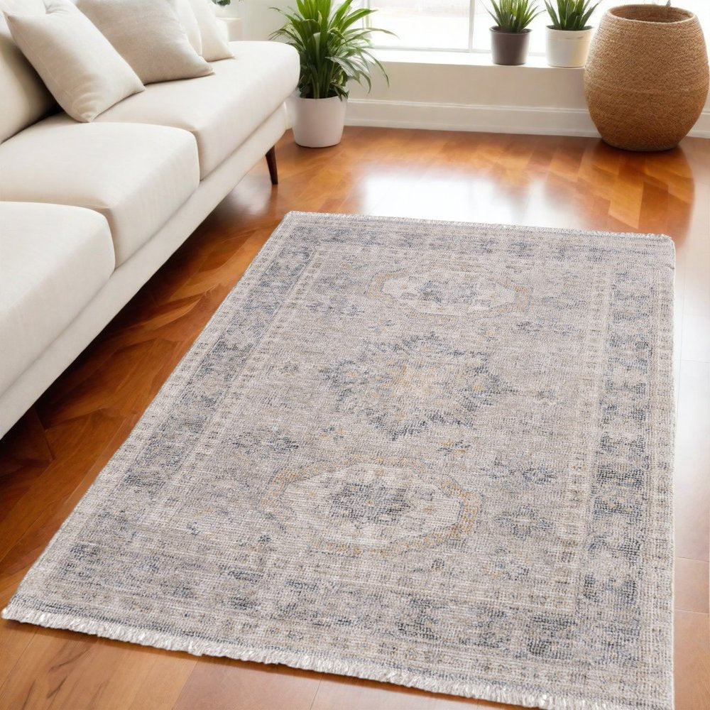 4' X 6' Tan and Gray Oriental Hand Woven Distressed Area Rug With Fringe
