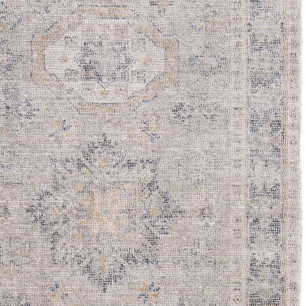 4' X 6' Tan and Gray Oriental Hand Woven Distressed Area Rug With Fringe