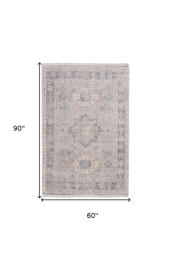 4' X 6' Tan and Gray Oriental Hand Woven Distressed Area Rug With Fringe