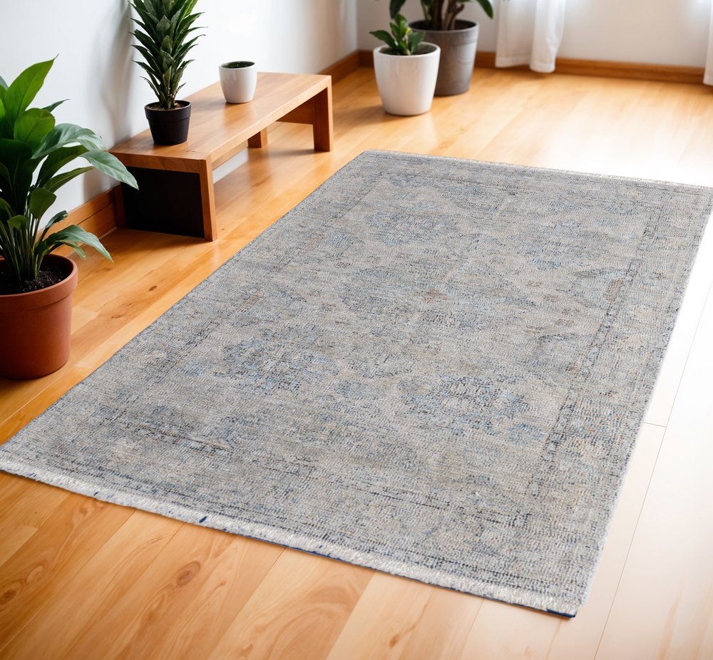 4' X 6' Gray Blue and Taupe Abstract Hand Woven Distressed Area Rug With Fringe