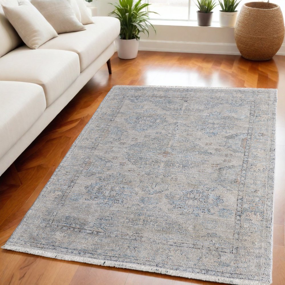 4' X 6' Gray Blue and Taupe Oriental Hand Woven Distressed Area Rug With Fringe