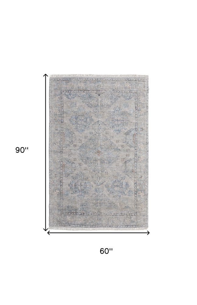 4' X 6' Gray Blue and Taupe Oriental Hand Woven Distressed Area Rug With Fringe