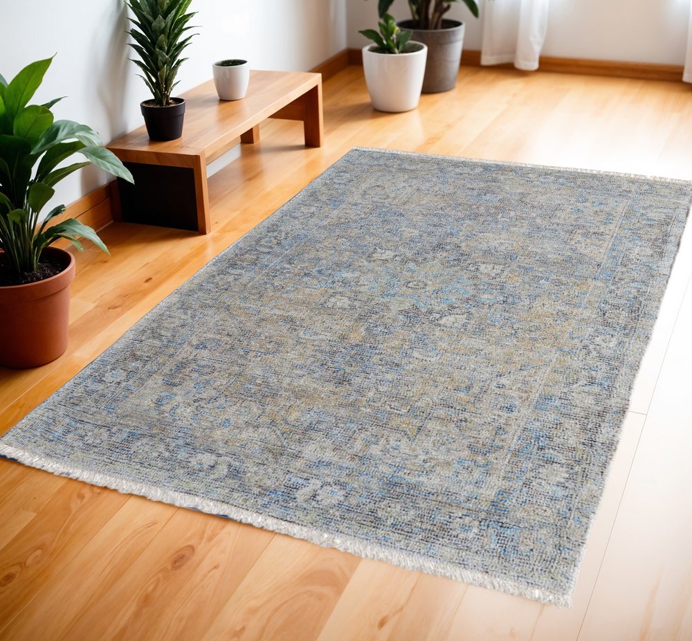 4' X 6' Gray Blue and Tan Abstract Hand Woven Distressed Area Rug With Fringe