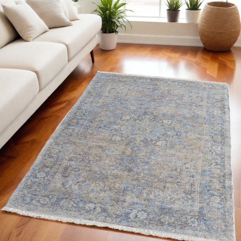 4' X 6' Gray Blue and Tan Abstract Hand Woven Distressed Area Rug With Fringe