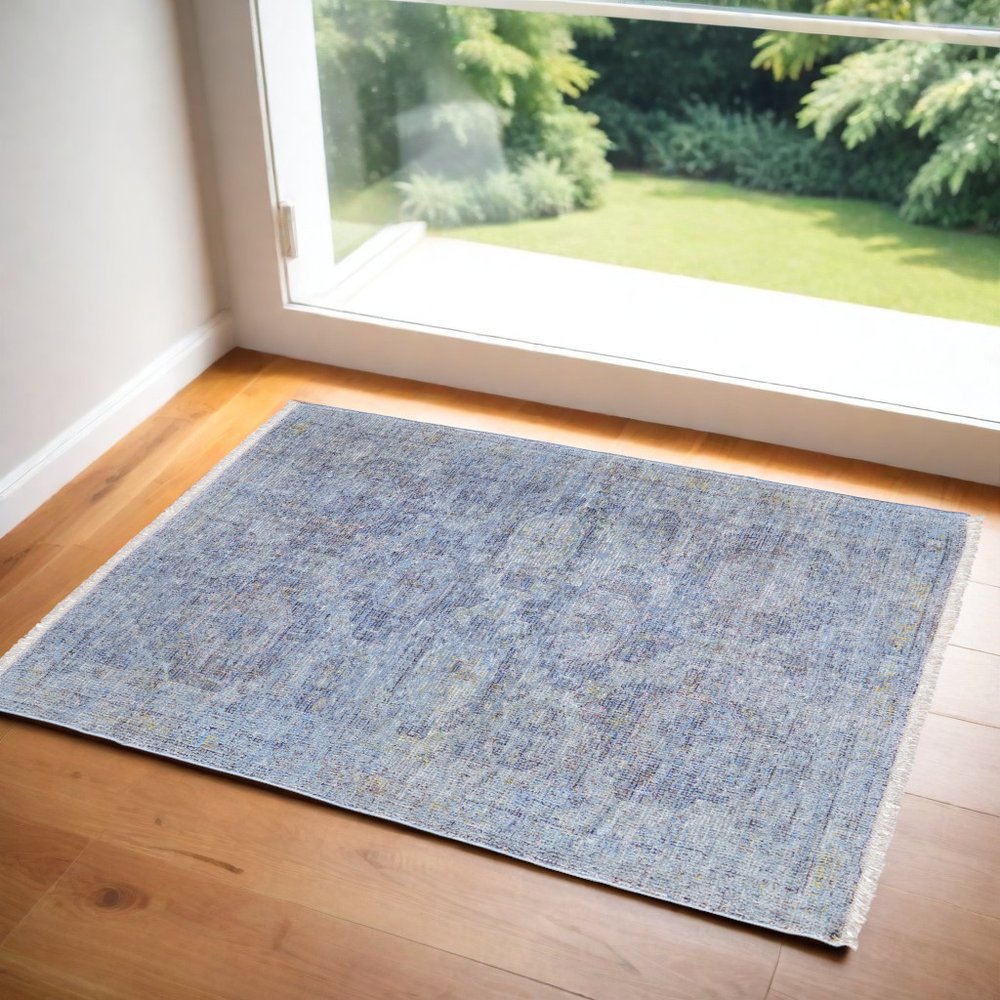 4' X 6' Blue and Ivory Abstract Hand Woven Distressed Area Rug With Fringe