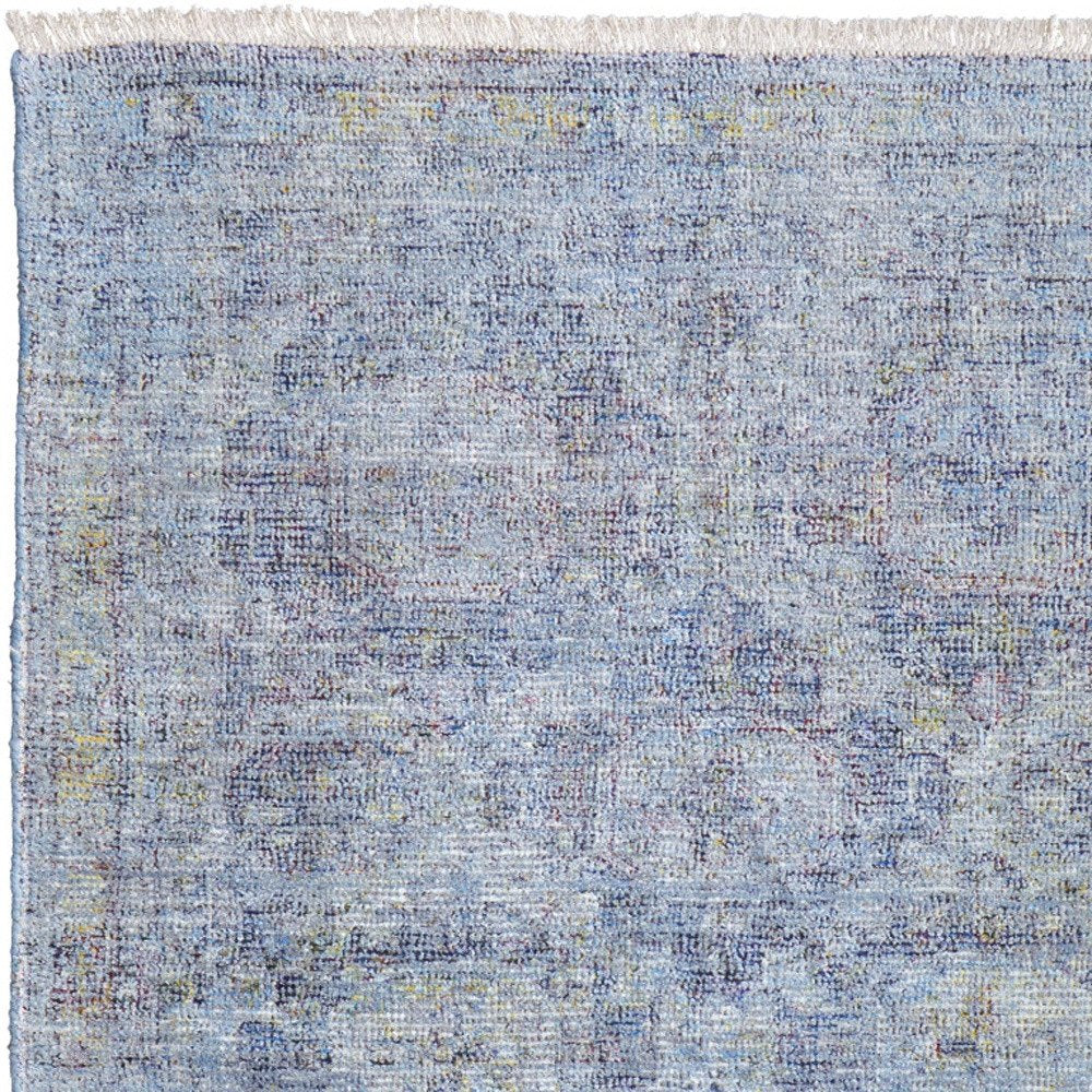 4' X 6' Blue and Ivory Abstract Hand Woven Distressed Area Rug With Fringe