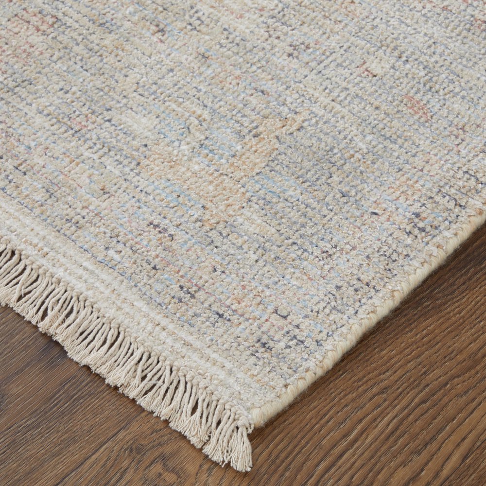 4' X 6' Ivory Tan and Blue Floral Hand Woven Distressed Area Rug With Fringe