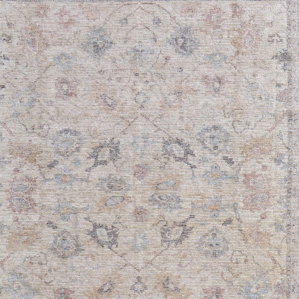 4' X 6' Ivory Tan and Blue Floral Hand Woven Distressed Area Rug With Fringe