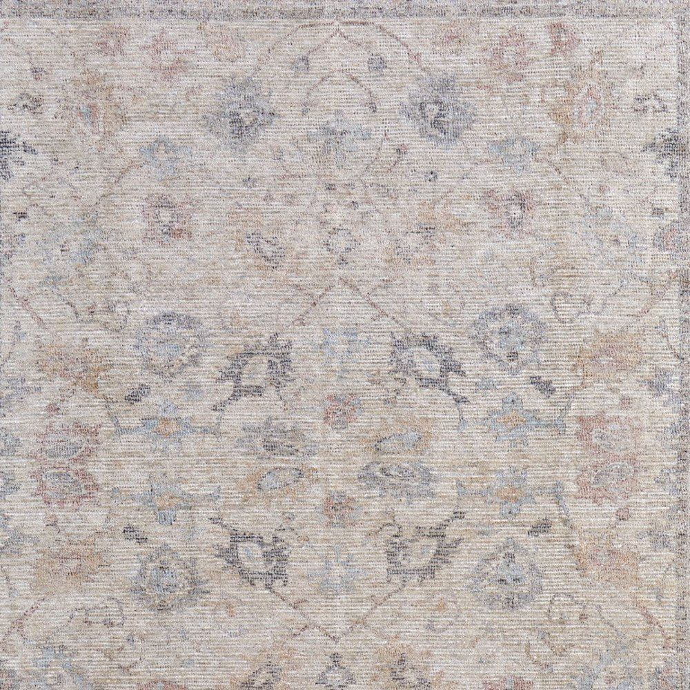 4' X 6' Ivory Tan and Blue Floral Hand Woven Distressed Area Rug With Fringe