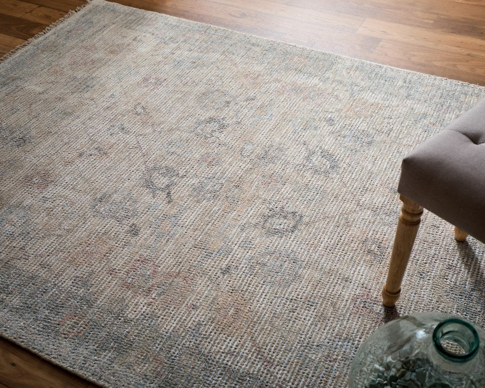 4' X 6' Ivory Tan and Blue Floral Hand Woven Distressed Area Rug With Fringe