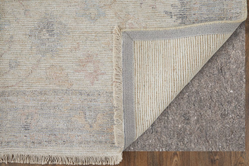 4' X 6' Ivory Tan and Blue Floral Hand Woven Distressed Area Rug With Fringe
