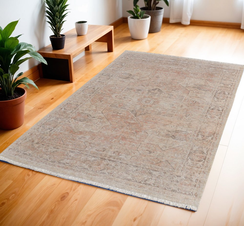 4' X 6' Tan Orange and Ivory Oriental Hand Woven Distressed Area Rug With Fringe