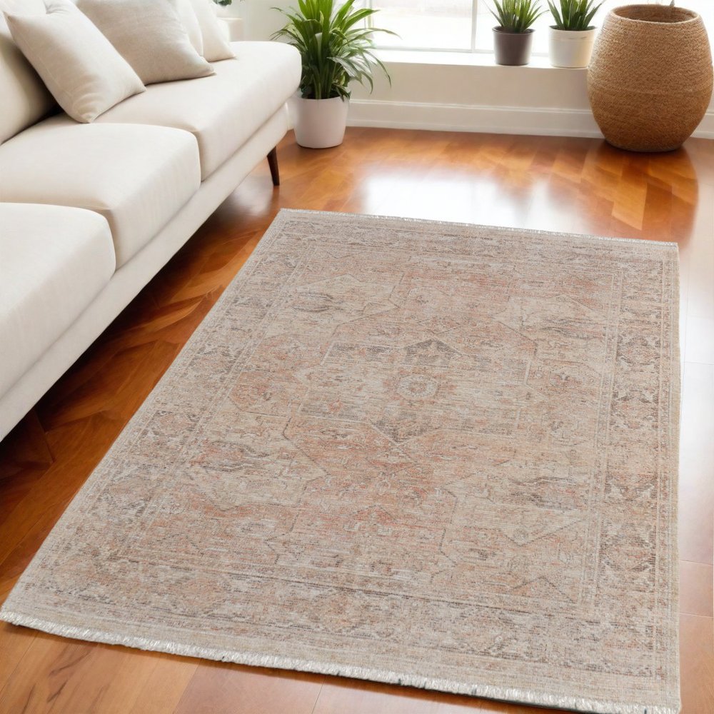 4' X 6' Tan Orange and Ivory Oriental Hand Woven Distressed Area Rug With Fringe