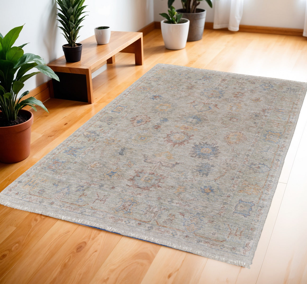 4' X 6' Tan Brown and Blue Floral Hand Woven Distressed Area Rug With Fringe