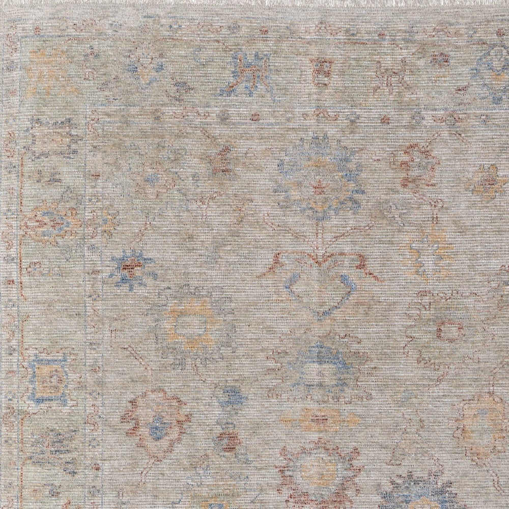 4' X 6' Tan Brown and Blue Floral Hand Woven Distressed Area Rug With Fringe