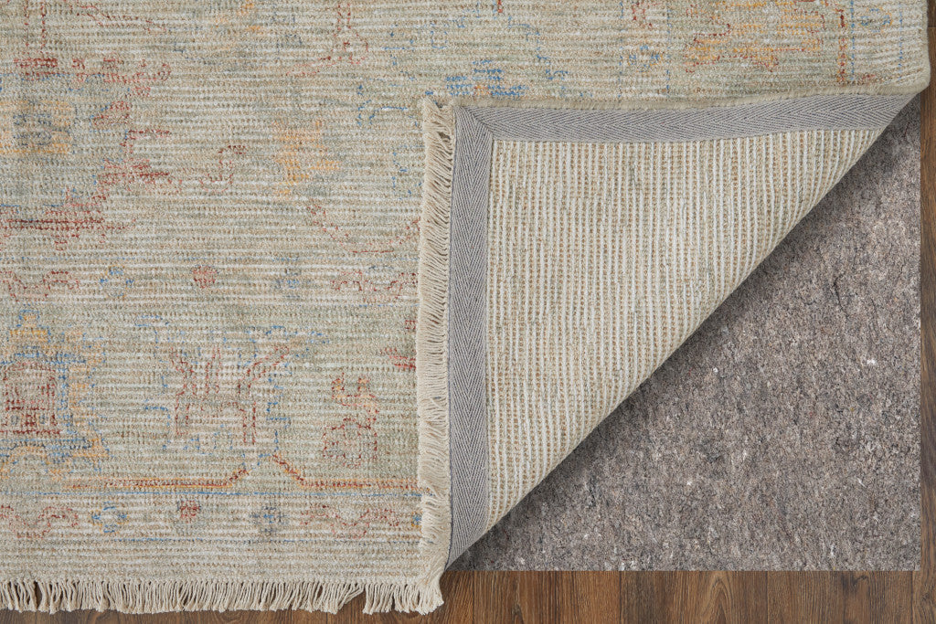 4' X 6' Tan Brown and Blue Floral Hand Woven Distressed Area Rug With Fringe