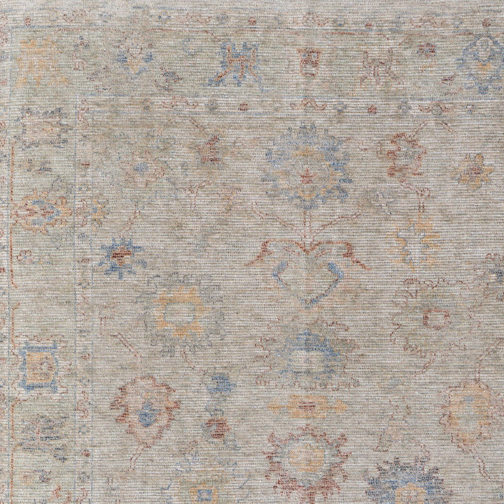 4' X 6' Tan Brown and Blue Floral Hand Woven Distressed Area Rug With Fringe