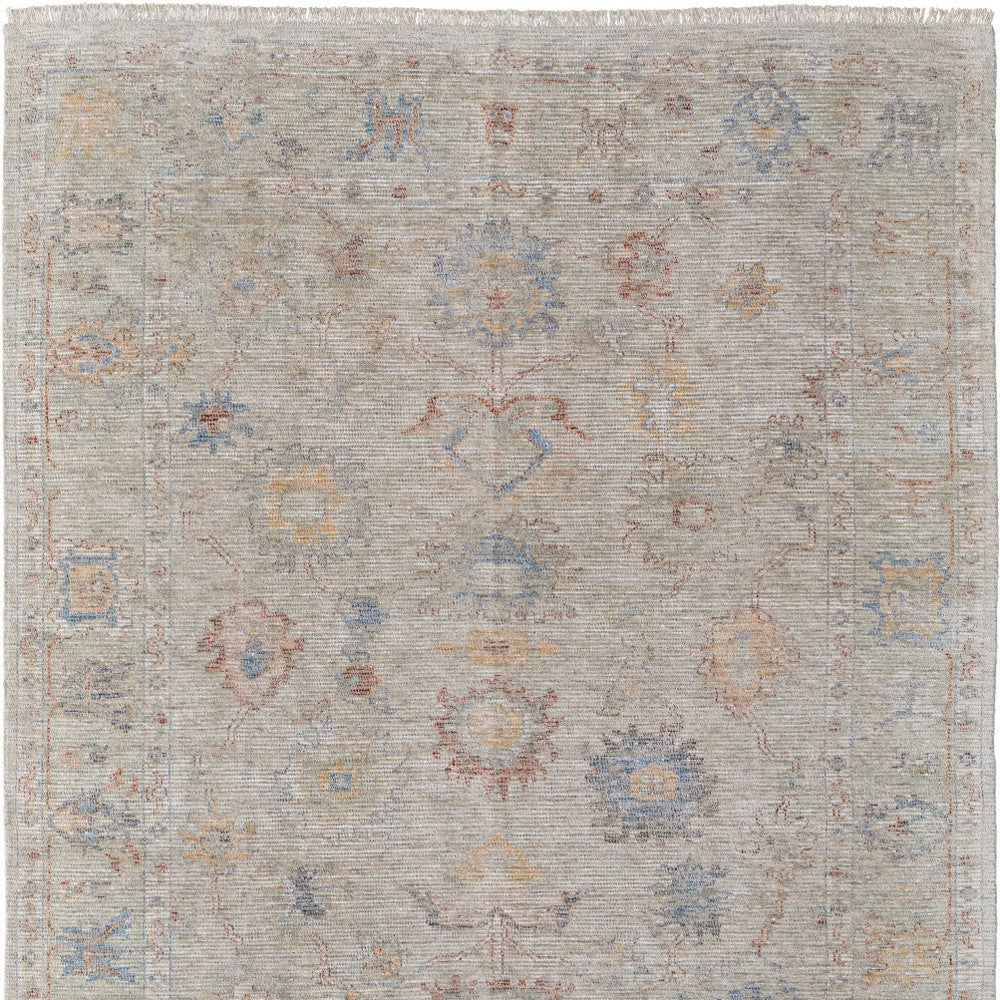 4' X 6' Tan Brown and Blue Floral Hand Woven Distressed Area Rug With Fringe