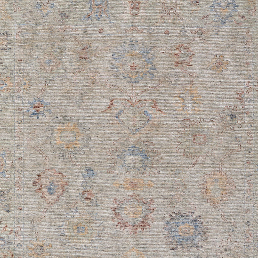 4' X 6' Tan Brown and Blue Floral Hand Woven Distressed Area Rug With Fringe