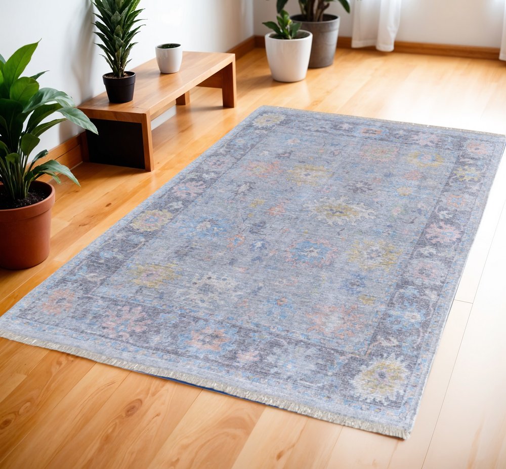 4' X 6' Orange Blue and Gold Floral Hand Woven Distressed Area Rug With Fringe