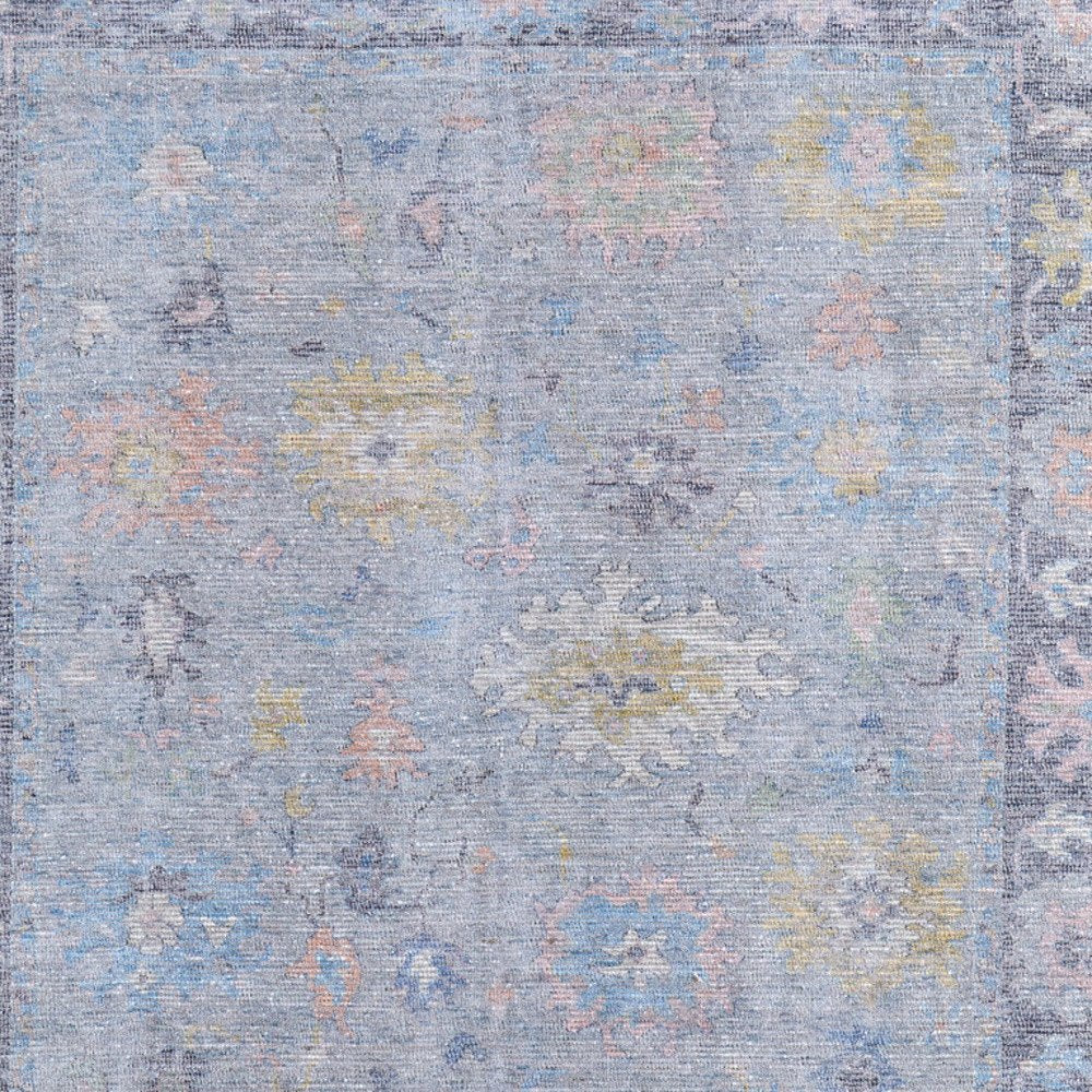 4' X 6' Orange Blue and Gold Floral Hand Woven Distressed Area Rug With Fringe